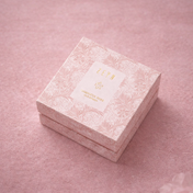Pink Zeyn box with floral patterns on a pink background. DamascusRoseBox_Refill_PDP_Elevated
