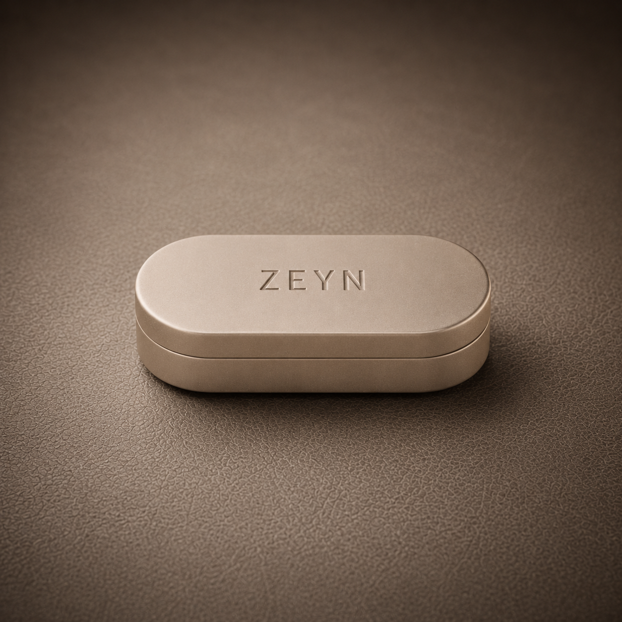 ZEYN refillable solid fragrance case in warm stone finish on textured taupe background