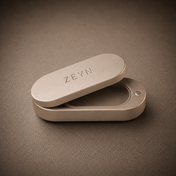 ZEYN warm stone refillable fragrance case shown open and empty without scent refill
